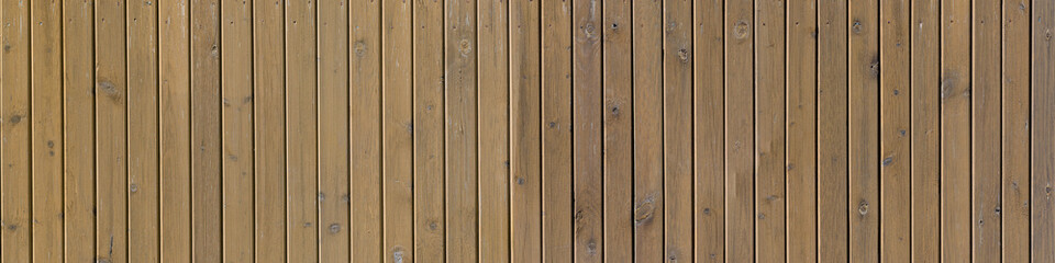 Fototapeta premium Wooden fence surface, wooden texture of a panoramic view. Texture of rustic wood planks aged.