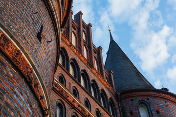 Front view of Holstentor in Lübeck towards the sky UNESCO World Heritage Site landmark Gothic...