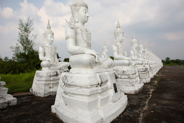 Art buddha statue image of Wat Phra Buddhabat Nam Thip temple for thai people and foreign travelers travel visit and respect praying at Phu Phan city in Sakon Nakhon, Thailand