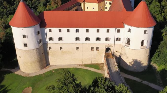 Bridge accessing mighty facade of castle, Mokrice, Slovenia. Aerial
