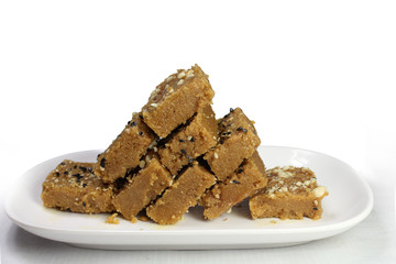 Sukhadi or Gor Papdi is Indian Traditional sweet made with wheat flour,desi ghee,jaggeery and nuts.very healthy Gujarati Mithai