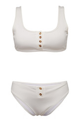 Detailed shot of a white two-piece swimsuit consists of a t-shirt bra and bikini. The swimming suit is decorated with golden buttons and isolated on the white background.