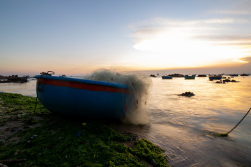 Fishing boats on Binh Thuan beach on the sunrise on Binh Thuan province, Vietnam