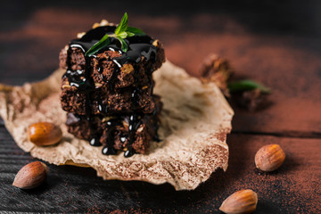 High Angle Tower Of Chocolate Nut Brownies  With Chocolate Syrup