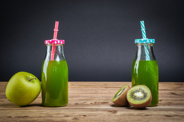 Vegetarian healthy food. Source of protein for vegetarians. Healthy eating: kiwi, apple, juice on dark background.