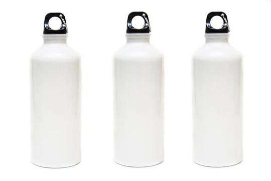 Three white bottles for water on white background.Aluminum eco bottle.Thermos.Products for branding.Merchandise.Drawing a logo of products.Isolated.Place for text.Front view Stop plastic.Eco product