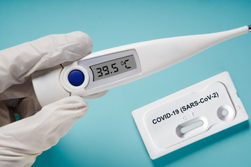 Doctor holding a test kit for viral disease COVID-19 2019-nCoV. Lab card kit test for viral novel coronavirus sars-cov-2 virus