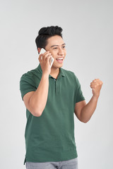 Happy smile face of handsome Asian man use smartphone.