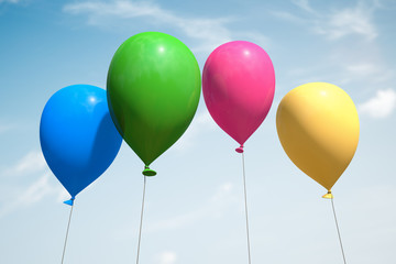 Obraz premium Several flying colored inflatable balloons against the sky.