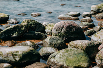 Ocean shore, big rocks on the sea coast.