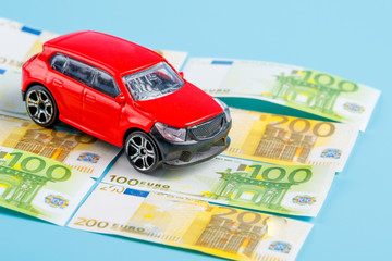 on European money is a red toy car