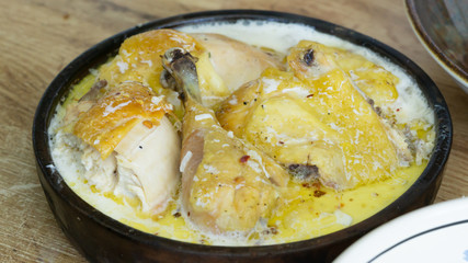Shkmeruli - a dish of Georgian cuisine from the mountain region Racha. Braised Chicken in Milk with Garlic
