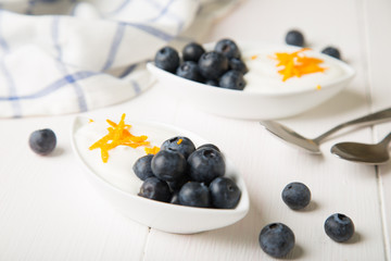 Yogurt with fresh blueberries and orange zest