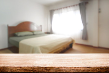 Fototapeta na wymiar Bedroom and empty wooden desk space platform for product presentation.