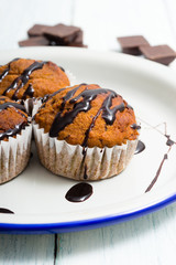 chocolate cupcakes, old white wooden table