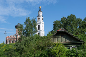 Attractions of Central Russia. Traditional rural house, Nikolsky Cathedral and the bell tower of Cathedral of the Resurrection (Voskresensky). Volokolamsk, Moscow Oblast, Russia.
