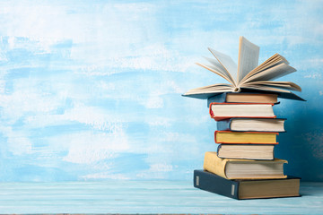 Law concept - Open law book with a wooden judges gavel on table in a courtroom or law enforcement office isolated on white background. Copy space for text