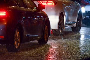 Cars on road in heavy rain at night