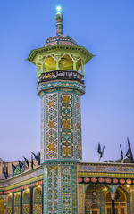 Naklejka premium Tower on one of the courytayrds of Fatima Masumeh Shrine in Qom city, Iran