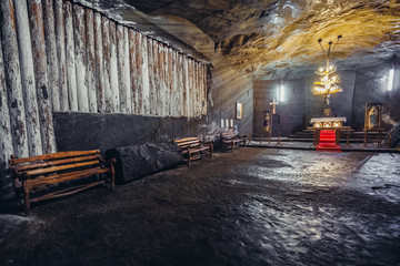 Fototapeta na wymiar Large chamber with chapel in Cacica Salt Mine in Romania