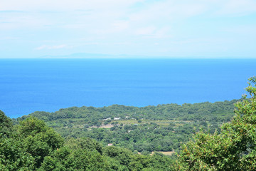 Fototapeta premium view from the top of the mountain to the coast of the sea over forest in Therma area, Samothraki island, Greece, Aegean sea
