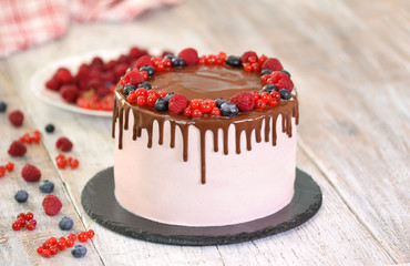 Delicious cake decorated with summer berries. Cake with summer berries