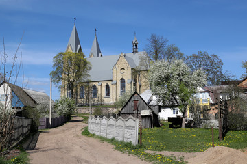 The Catholic Church of Our Lady of Ruzantsova and St. Dominic, built of yellow brick in the Neo-Gothic style in the city of Rakov, Belarus.