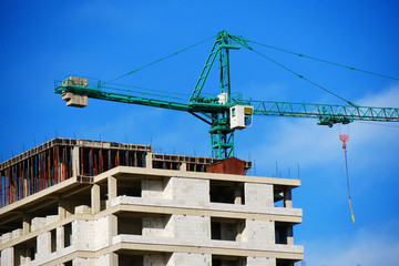 Naklejka premium Construction site. Building site with crane. Concrete building under construction