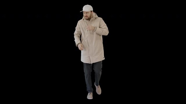 Man in winter outfit walking and coughing, Alpha Channel