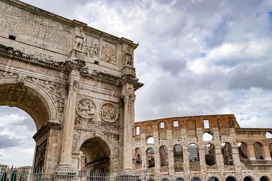 arch of titus near ancient colosseum in rome