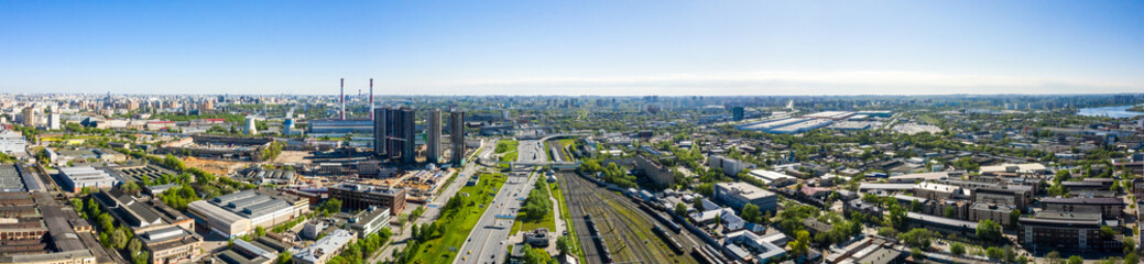 Fototapeta na wymiar Aerial top view of road junction in Moscow from above, automobile traffic and the old Ugreshskaya railway station in the Moscow industrial zone near the automobile ring highway