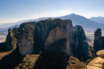 Scenic rock formations in mountains against blue sky