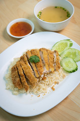 Fried chicken with rice. Thai Style Hainan Chicken. on The wood table.