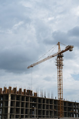 Operation of a tower crane during the construction of a multi-storey building