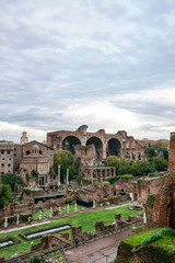 Fototapeta premium old buildings of rome against blue sky with clouds