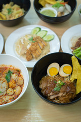 Top view composition with Thai Food. Chicken rice, Stewed pork leg on rice and noodle