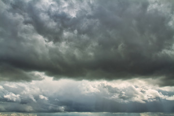 Fototapeta premium Cloudscape. Blue sky and grey clouds. Sunny day. Cumulus clouds.