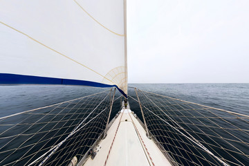 white sailing yacht sailing, view from the bow of the ship. Wide abstract panorama