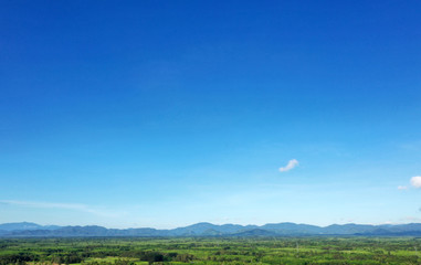 Aerial View of drone flying White clouds floating on the green mountains