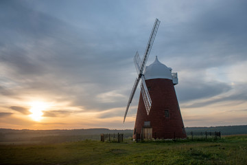 Beautiful sunset behind Halnaker windmill near Chichester in West Sussex, the mill is grade 2 listed and dates from the mid 18th century recently restored in 2018.