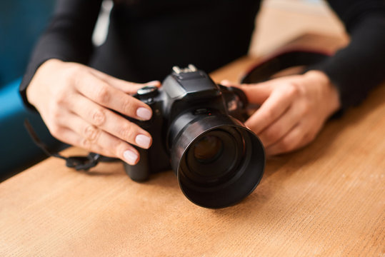 world photography day concept. closeup of hand of young woman with camera - Powered by Adobe