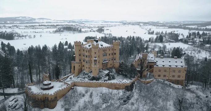 Hohenschwangau Castle in winter Aerial view landscape. Germany, Bavaria. Schwangau. Snowing. 4k video 24 fps. 19 marth, 2019.