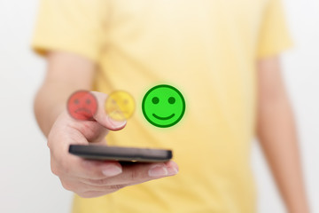 Customer Service Experience and Business Satisfaction Survey. Man choose face smile on smart phone