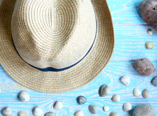 Fototapeta na wymiar Male hat close-up, sea shells, sea stones. Travel and tourism. Summer vacation concept.