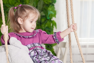 portrait of a three year old smiling little girl