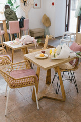 
Mousse cake, a cup of espresso and a bouquet of flowers. Flat lay. Beautiful composition with dessert. Concept of coffee shop and flower shop.