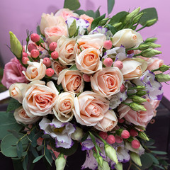 Obraz na płótnie Canvas Wedding bouquet of soft pink Bush roses close-up, beautiful bouquet of the bride.