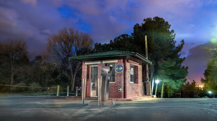 Abandoned security booth at night, with no body arround.