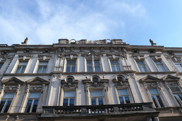 Fototapeta na wymiar Zagreb/Croatia-April 21st,2020: Facade of old building in city center damaged by strong earthquake that broke part of the roof and decoration off to the ground