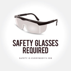 Warning sign - Safety glasses required. Plastic safety glasses.